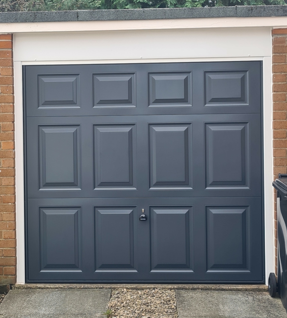Up and Over canopy garage door Garador georgian anthracite grey with white frame